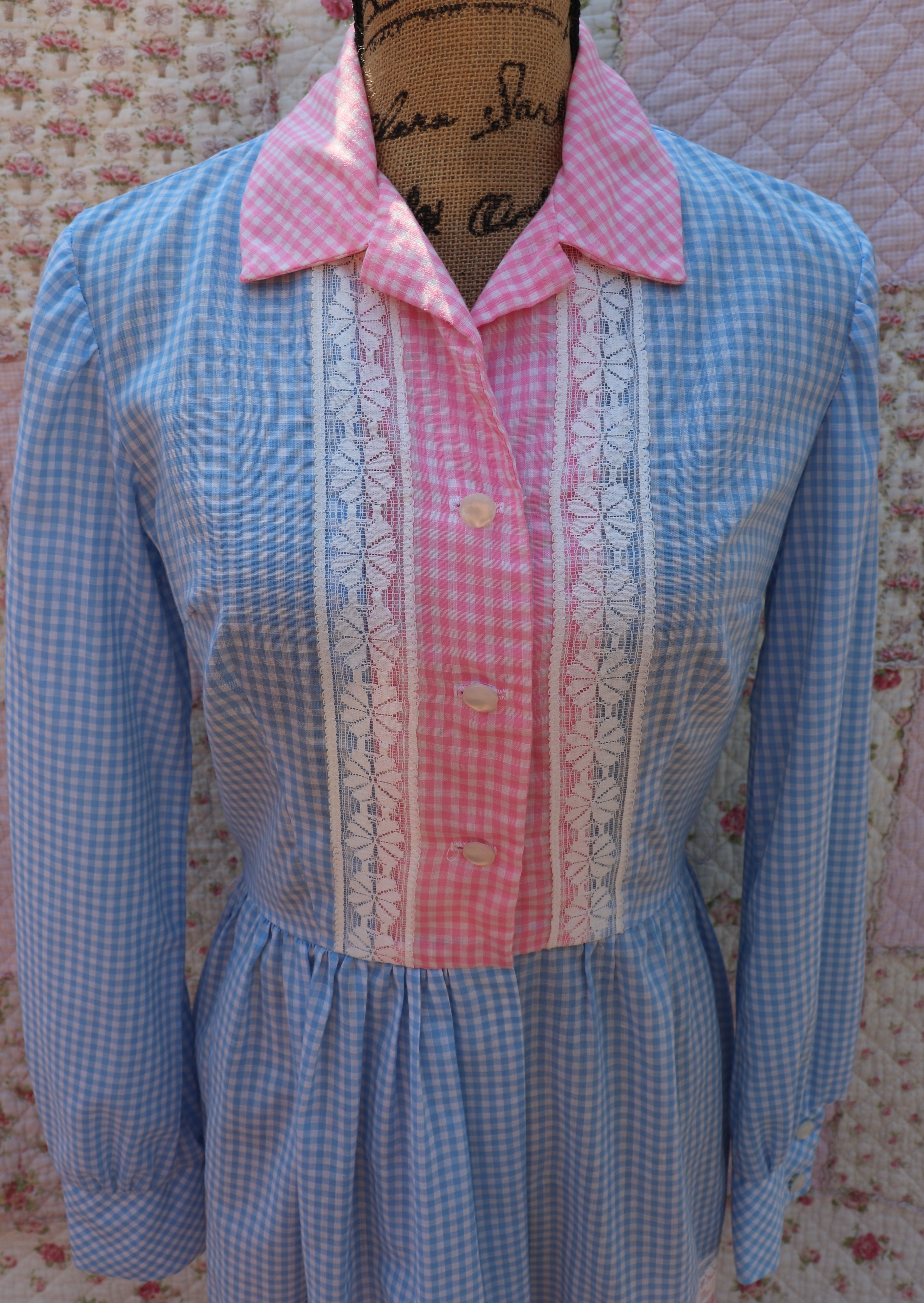 Soak up the sun in the iris dress from J&J Classics! This 1960s dress features a playful blue and white gingham print, accented with pink and white gingham. The long sleeves and collar add a touch of sophistication, while delicate floral lace details add a hint of sweet charm. Get ready to turn heads and spread some flower power with this dress!