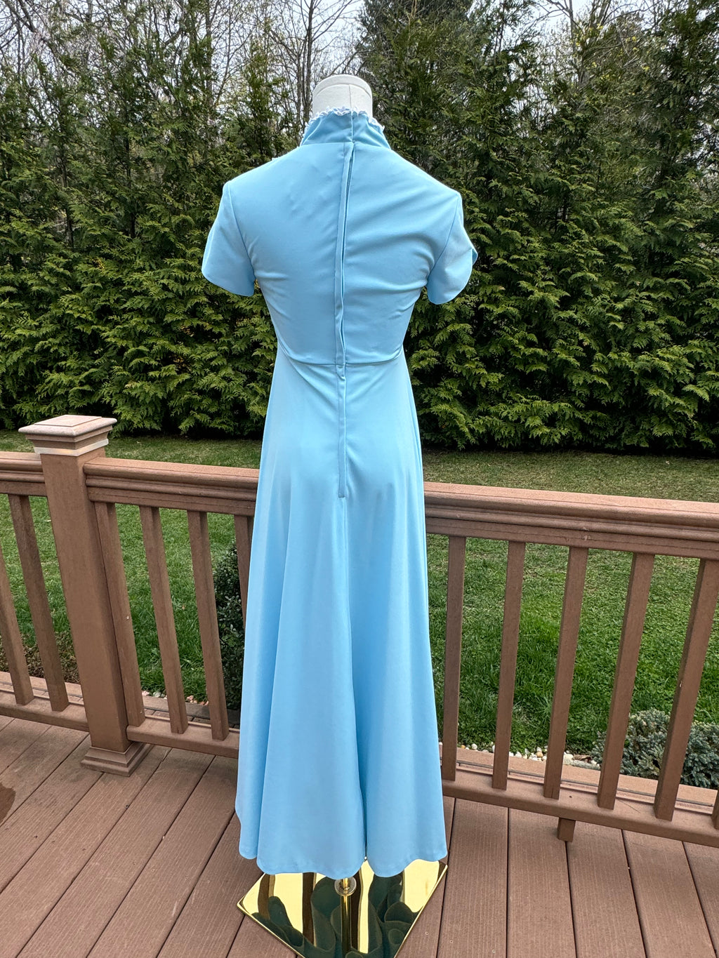 Be bold and turn heads in the jenna dress! This vintage empire waist gown features a bright blue color with playful white appliqué details. Homemade with a gorgeous 1970s silhouette, it is perfect for standing out at any summer event!